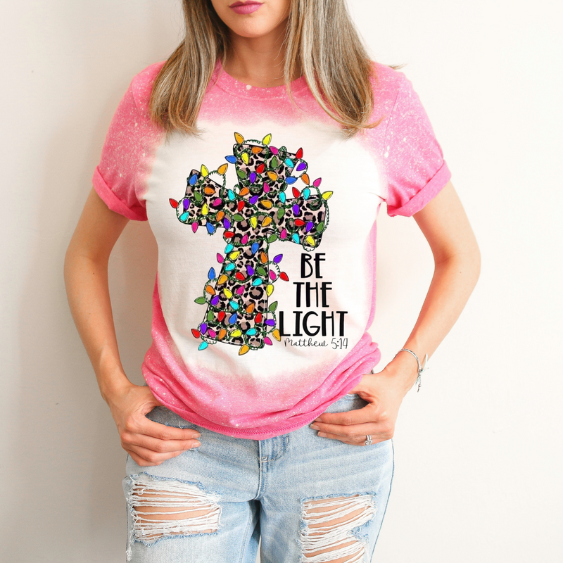 Be The Light Cross with Christmas Lights Bleached Pink T-Shirt